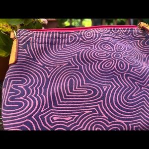 Dooney and Burke wristlet abstract heart with leather handle.